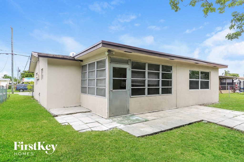 A small house with a FirstKey Homes logo.