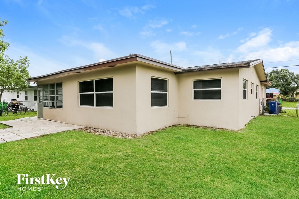 A house with a lawn in front of it.
