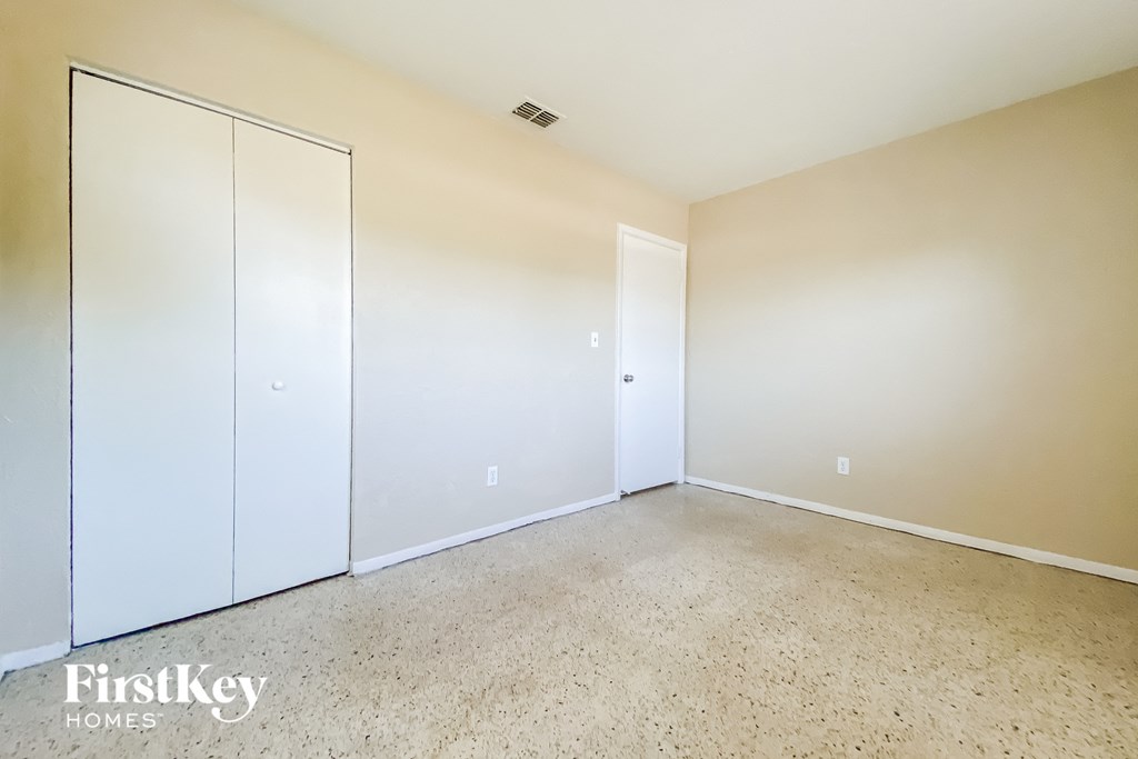 an empty room with white walls and white doors