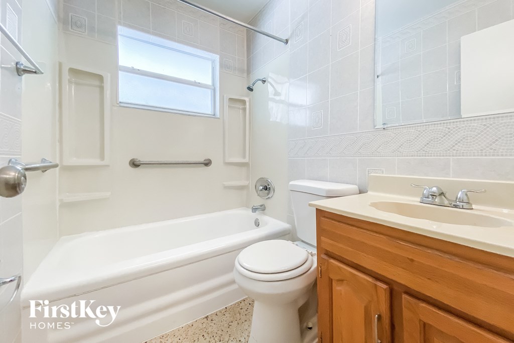 a bathroom with a sink toilet and a bath tub