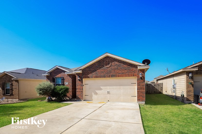 a house with a driveway and a garage door