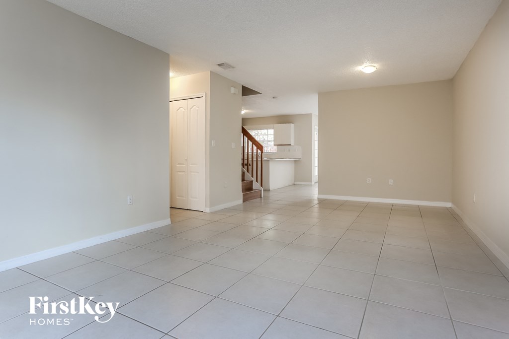 the living room and dining room are spacious and empty
