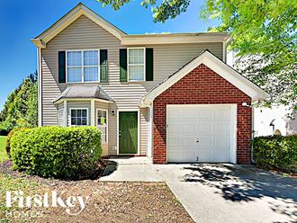a suburban house with a white garage door
