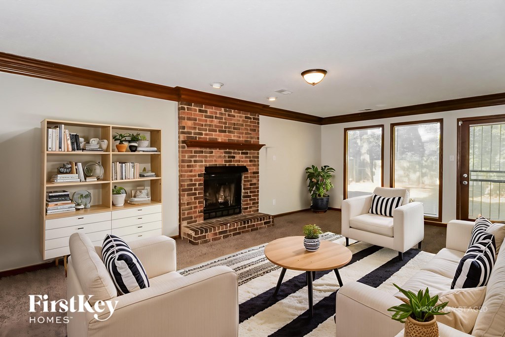 A living room with a fireplace and a couch.