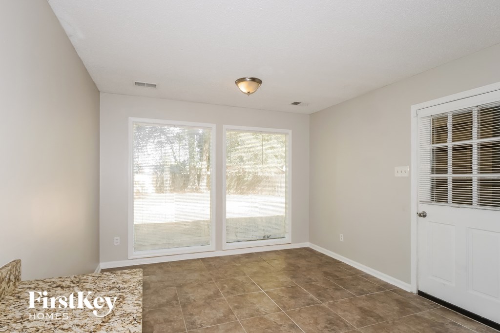 A room with a FirstKey Homes logo on the floor.