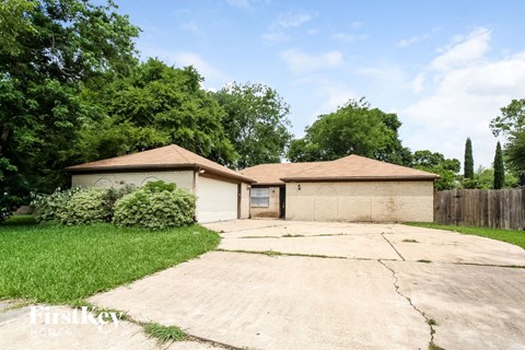 A house with a driveway in front of it.