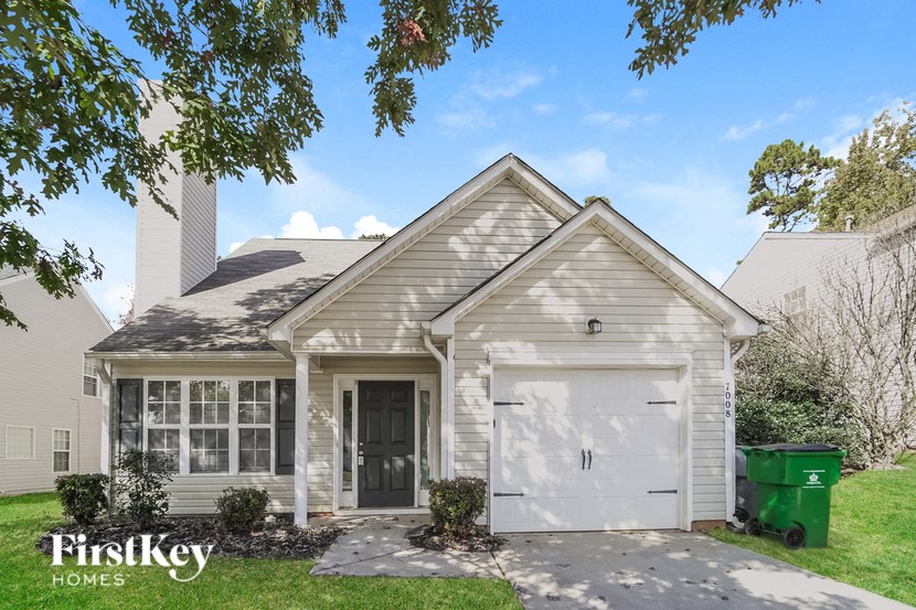 a white house with a white garage door