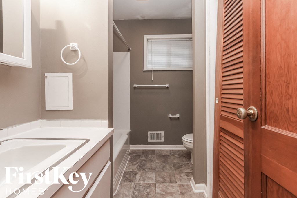 a bathroom with a sink and a toilet in it