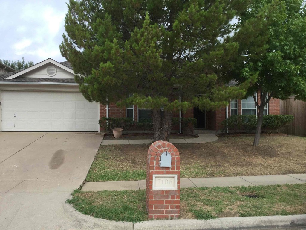 a house with a mailbox in the front of it
