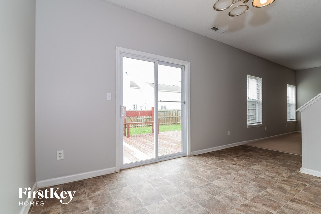 the living room with patio doors to the backyard