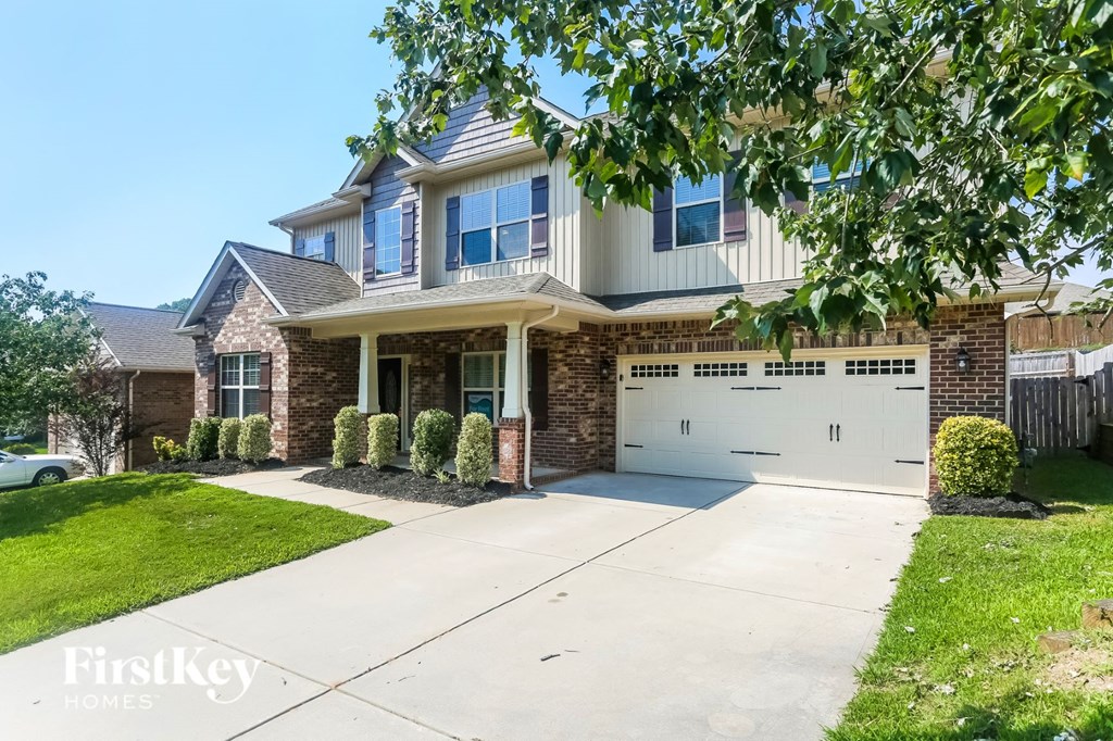 a house with a driveway and a garage door