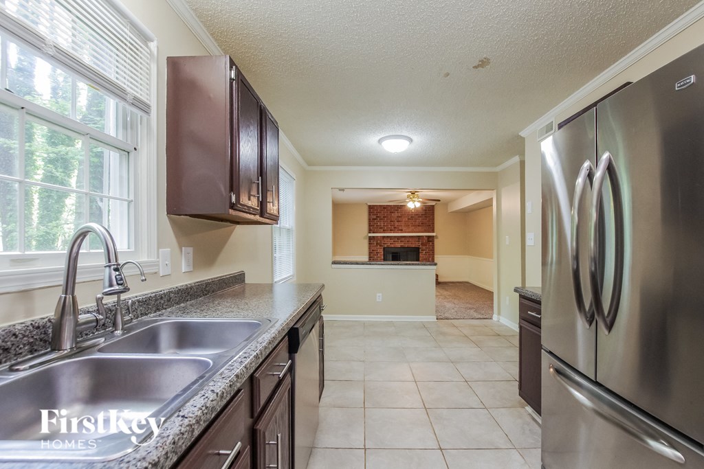 a kitchen with stainless steel appliances and granite counter tops