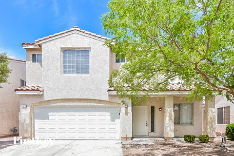 a white house with a white garage door