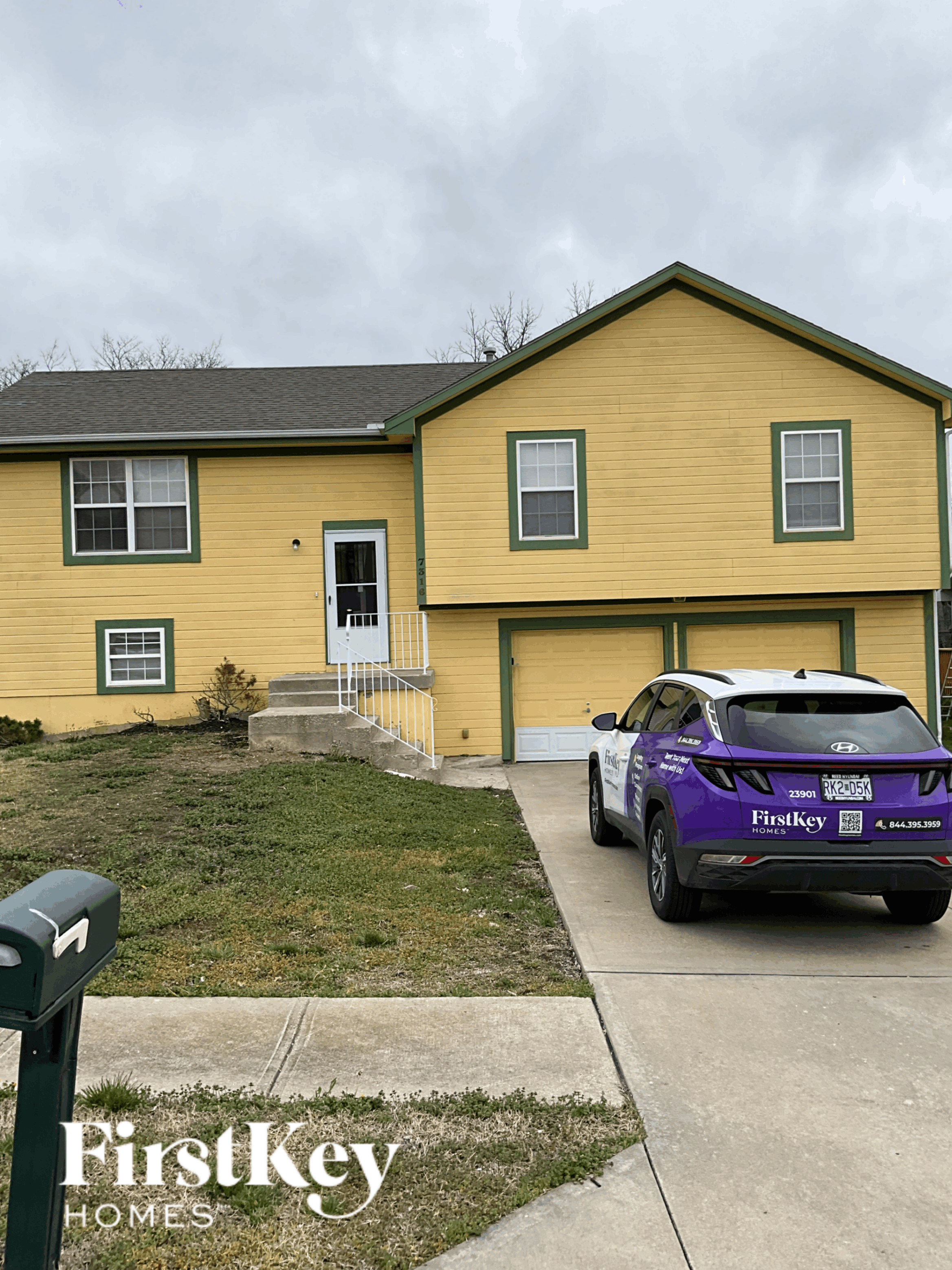 a purple car parked in front of a yellow house