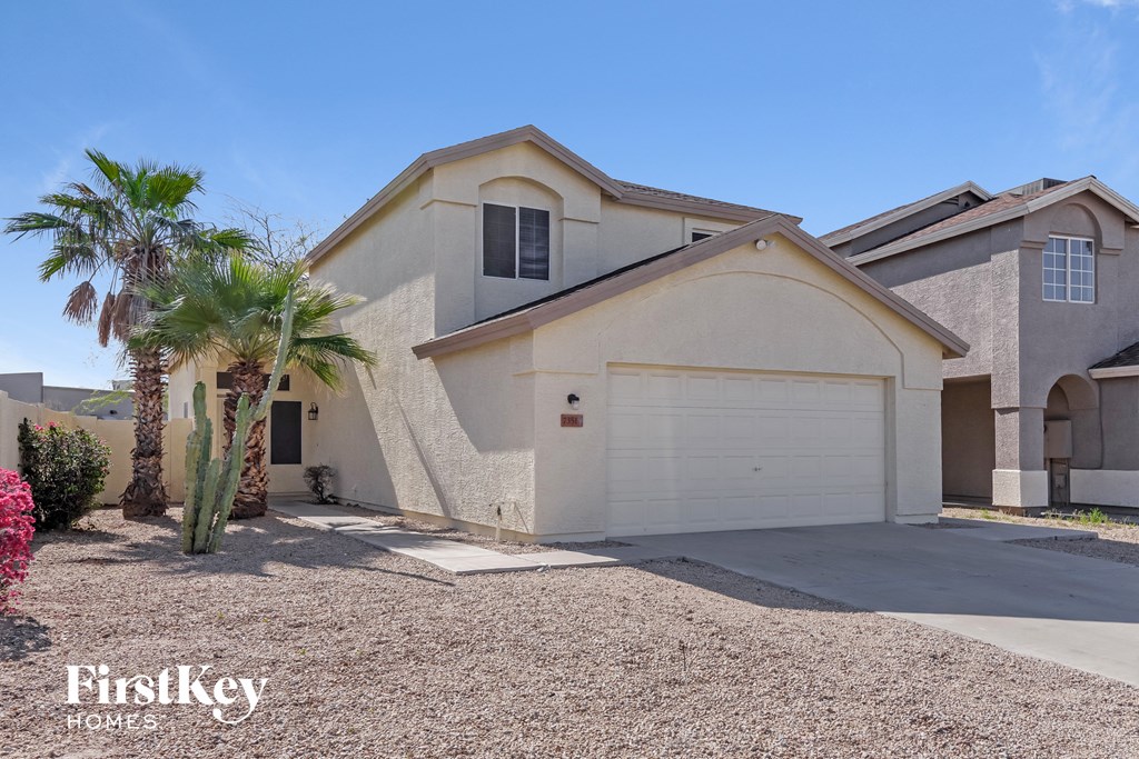 a house with a palm tree in front of it
