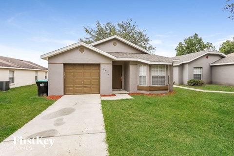 a home with a driveway and a garage door
