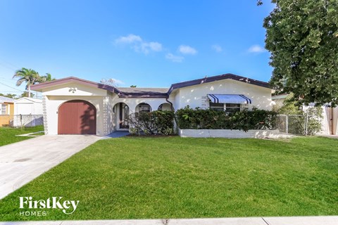 a house with a lawn and a garage