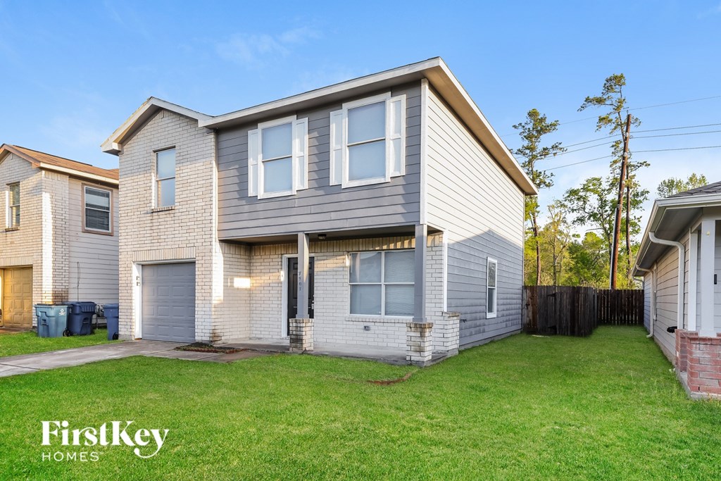 A house with a grey and white exterior is shown with the words "FirstKey Homes" on the bottom left.