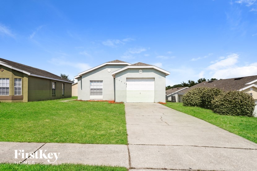 A house with a garage is for sale by FirstKey.
