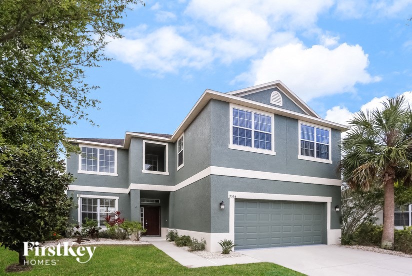 A modern house with a garage is for sale.