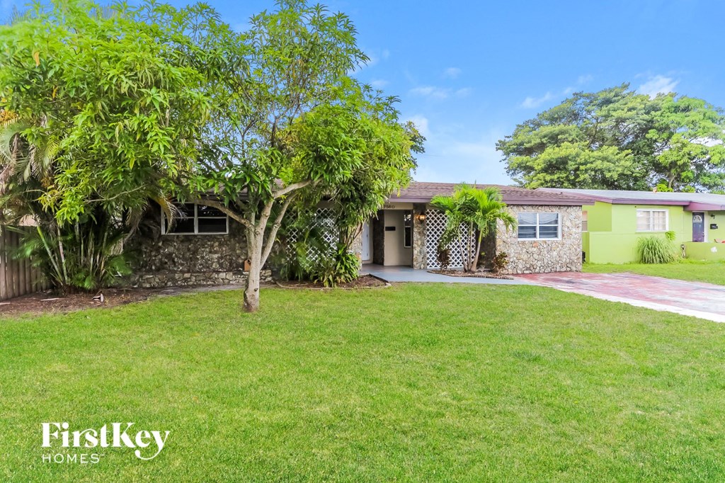 a house with a yard and a driveway