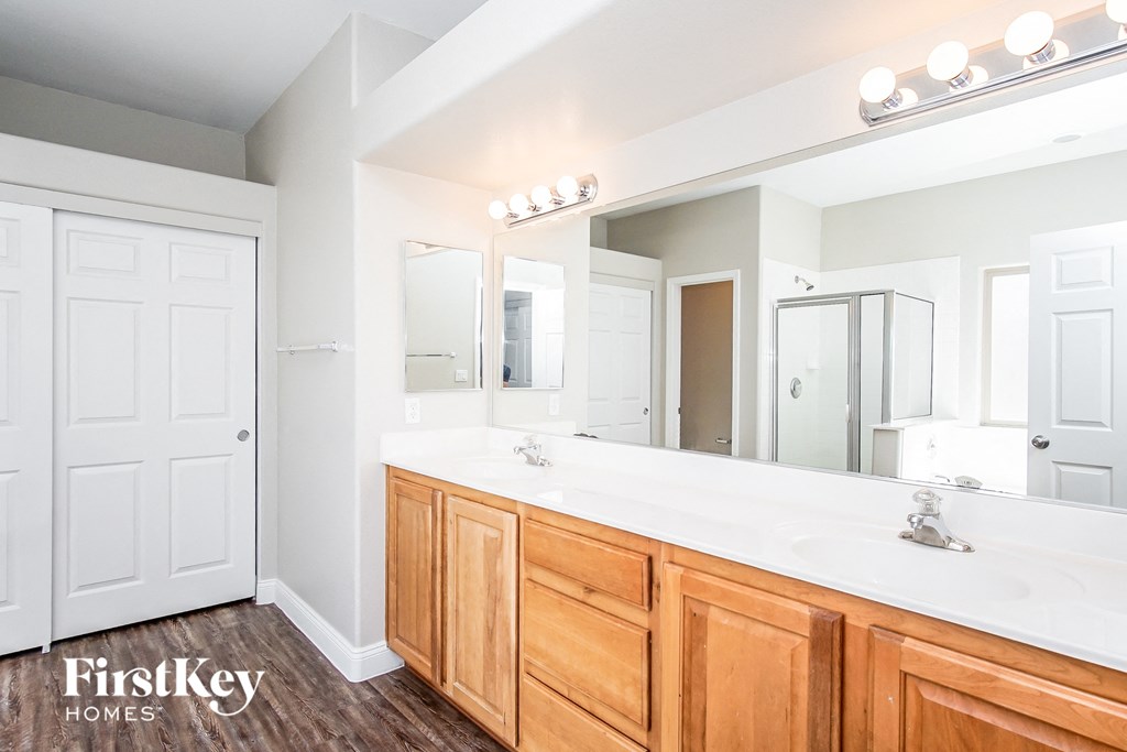 a bathroom with a large vanity and a large mirror
