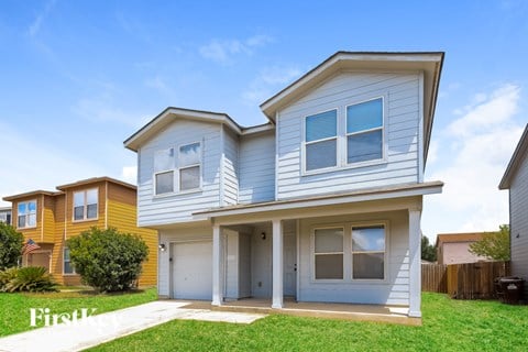 A two-story house with a garage is shown in the image.