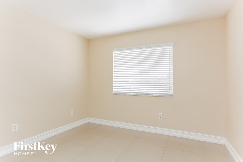 A room with a window and a FirstKey Homes logo.
