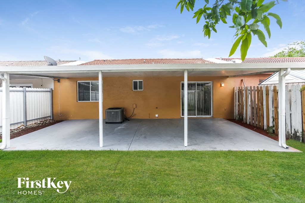 A house with a brown exterior and a white roof is for sale.