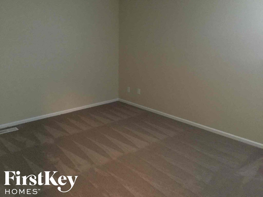 a empty room with a wooden floor