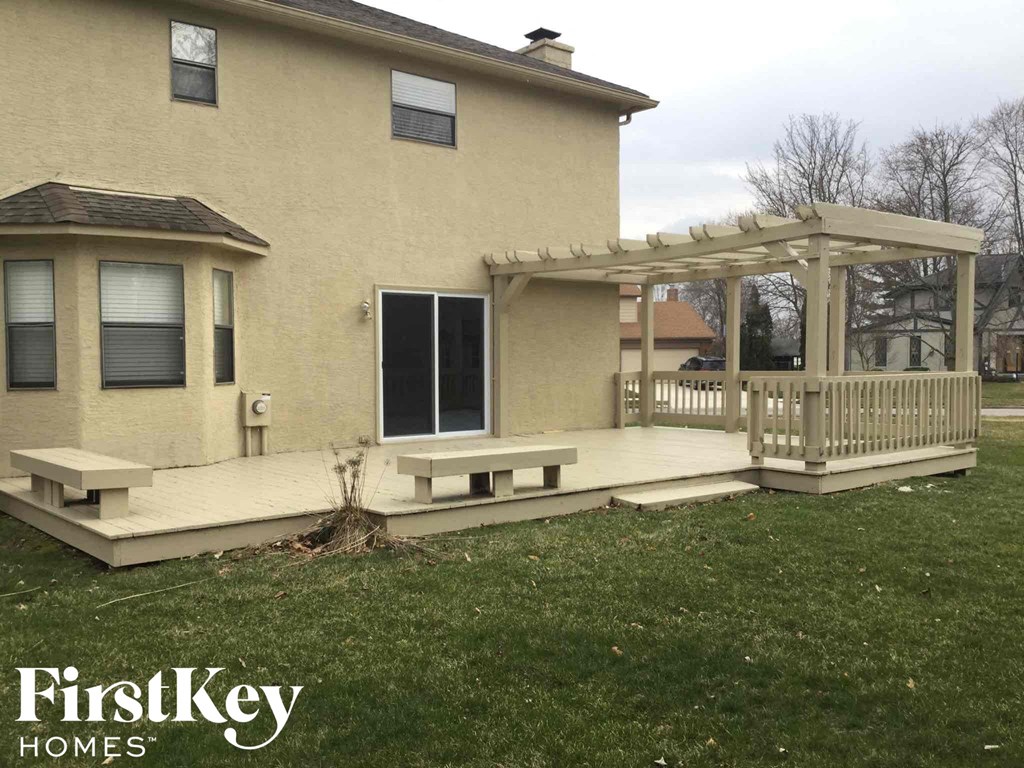 a house with a deck and a porch with a gazebo