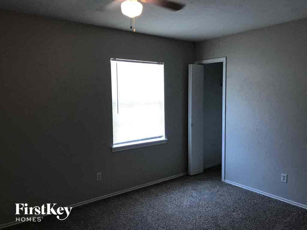 A room with a window and a door is shown.