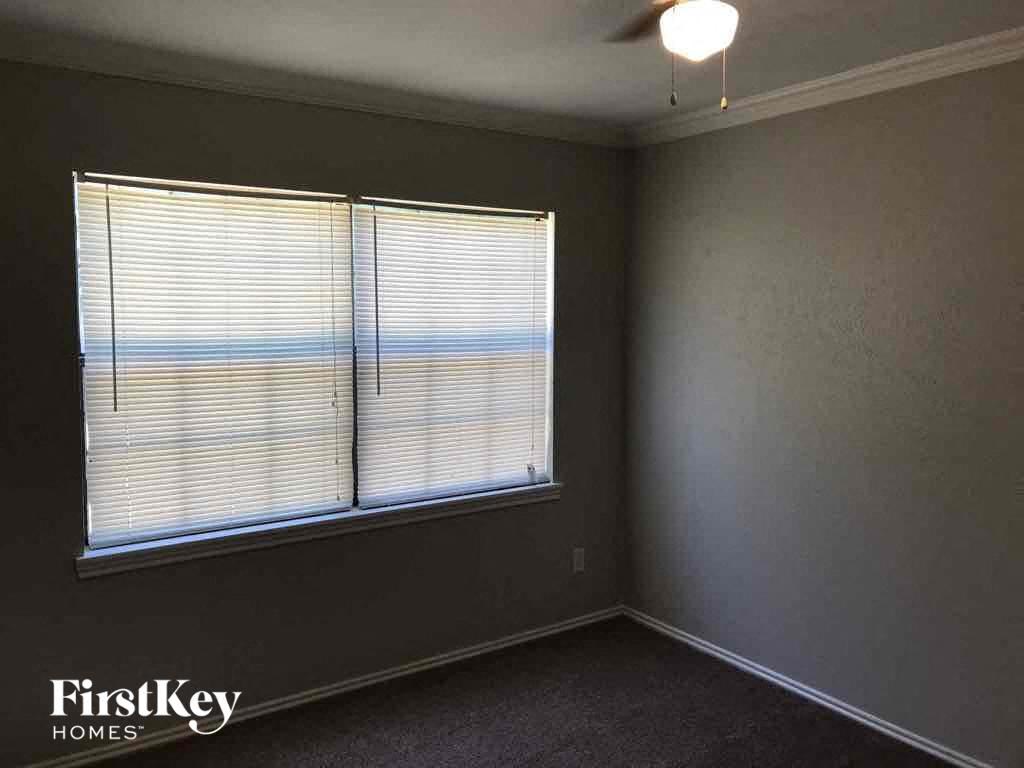 A room with a window overlooking the beach.