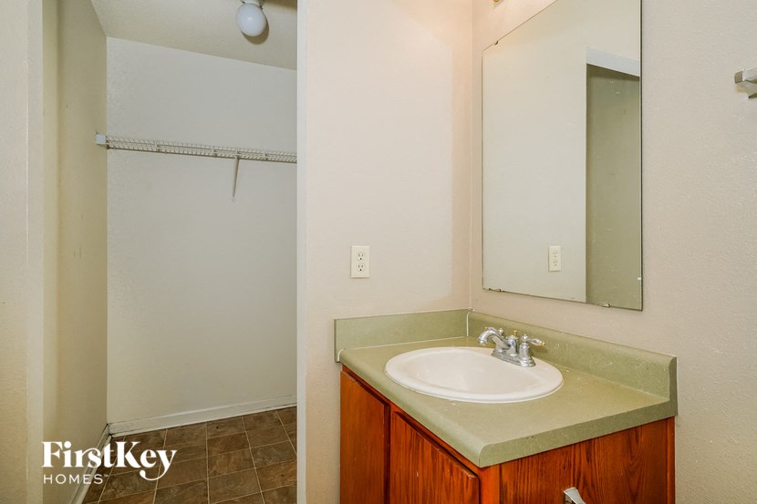 a bathroom with a sink and a mirror