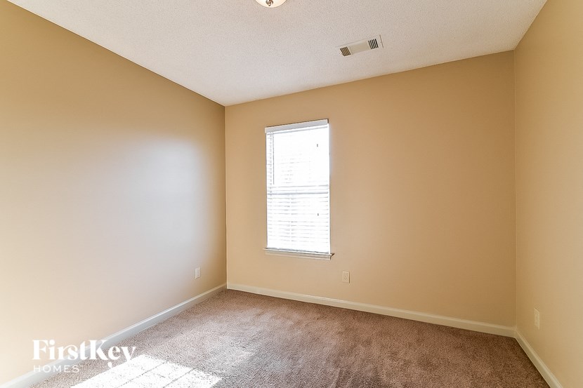 a room with carpet and a window