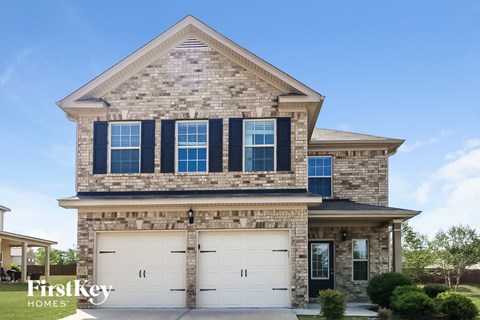 facade with white garage doors