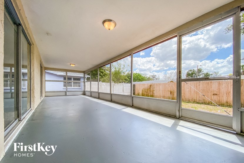 a large room with large windows and a concrete floor