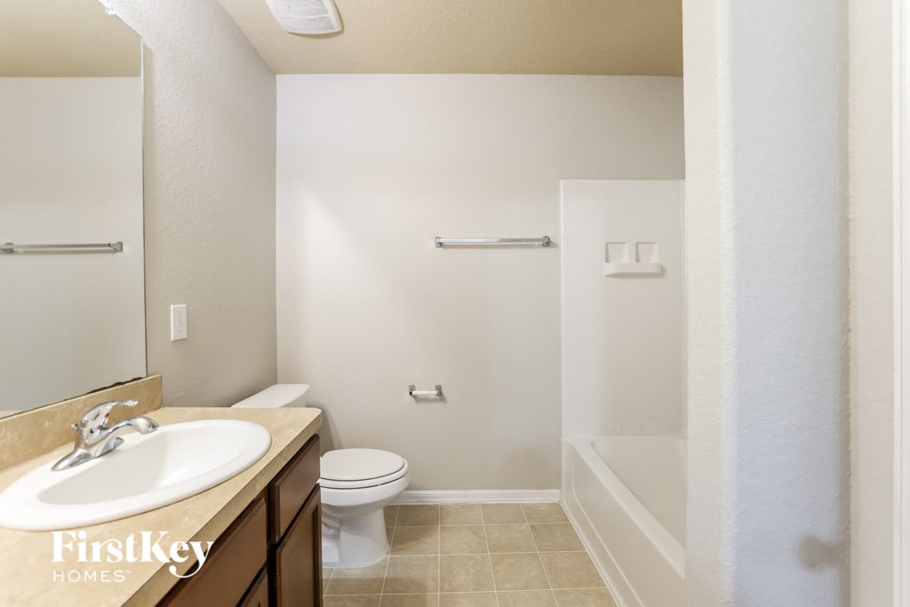 a bathroom with a sink toilet and a shower