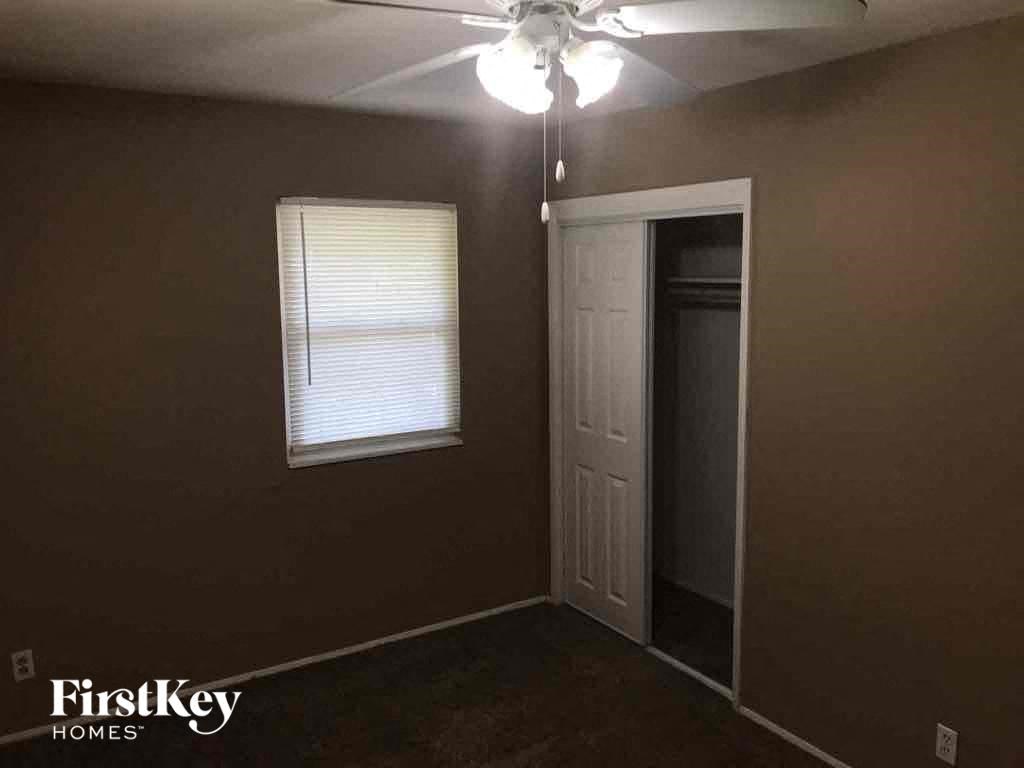 A room with a brown wall and a white door.