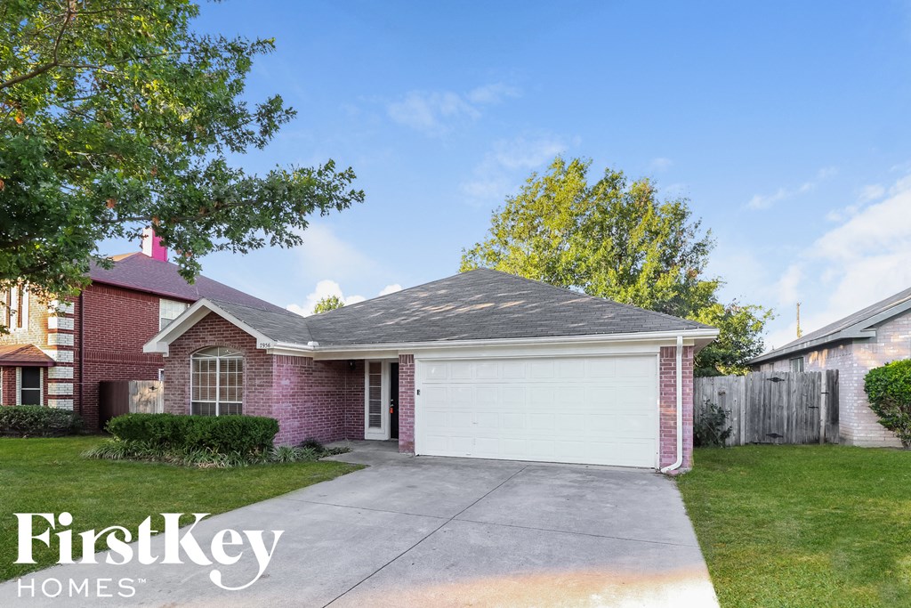 A house with a garage is for sale by FirstKey Homes.