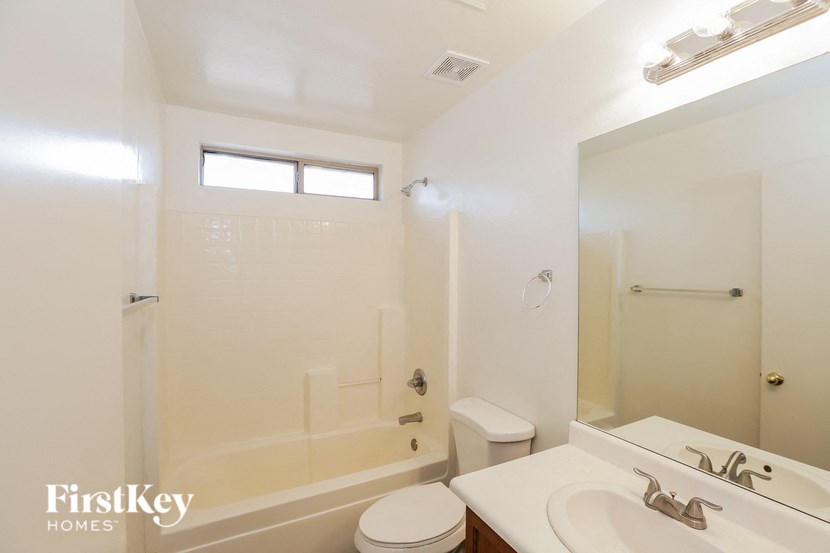 a bathroom with a sink toilet and a shower