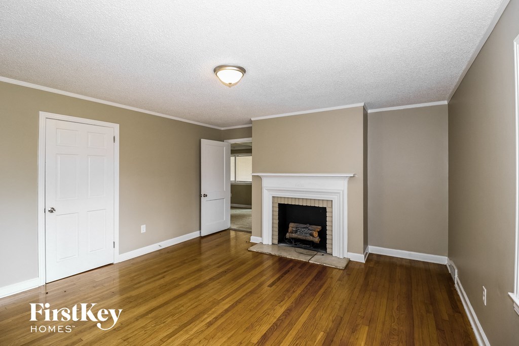 the living room of a house with a fireplace