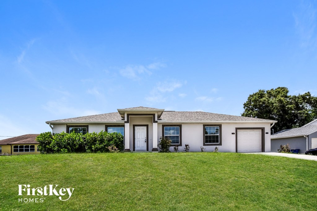 a house on a hill with a lawn