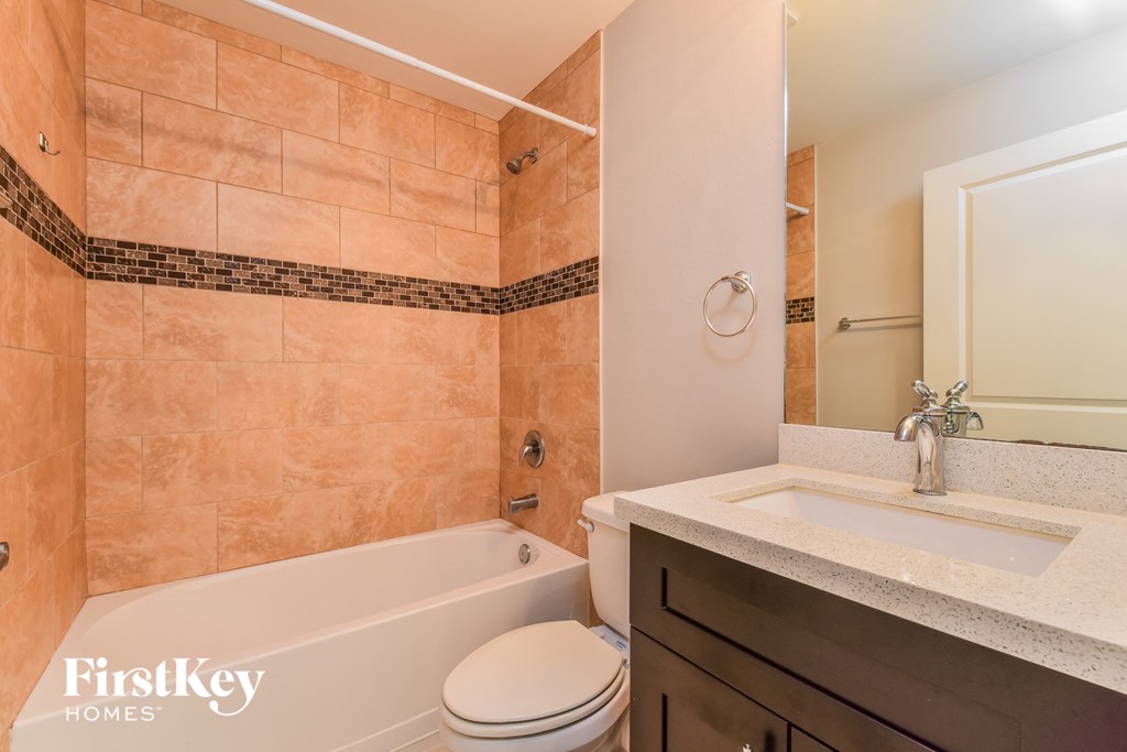 a bathroom with a sink toilet and tub and a shower