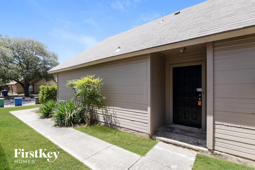 the front of a house with a garage door