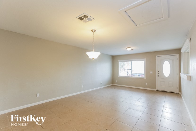 A room with a FirstKey Homes logo on the bottom left corner.
