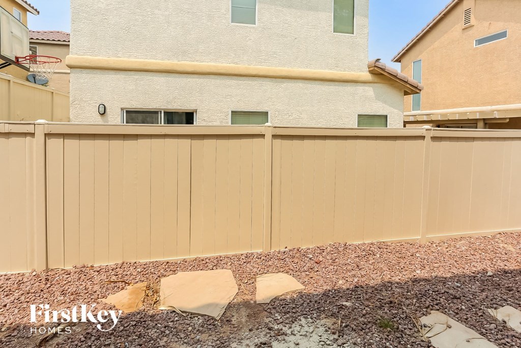 a wooden fence in front of a house