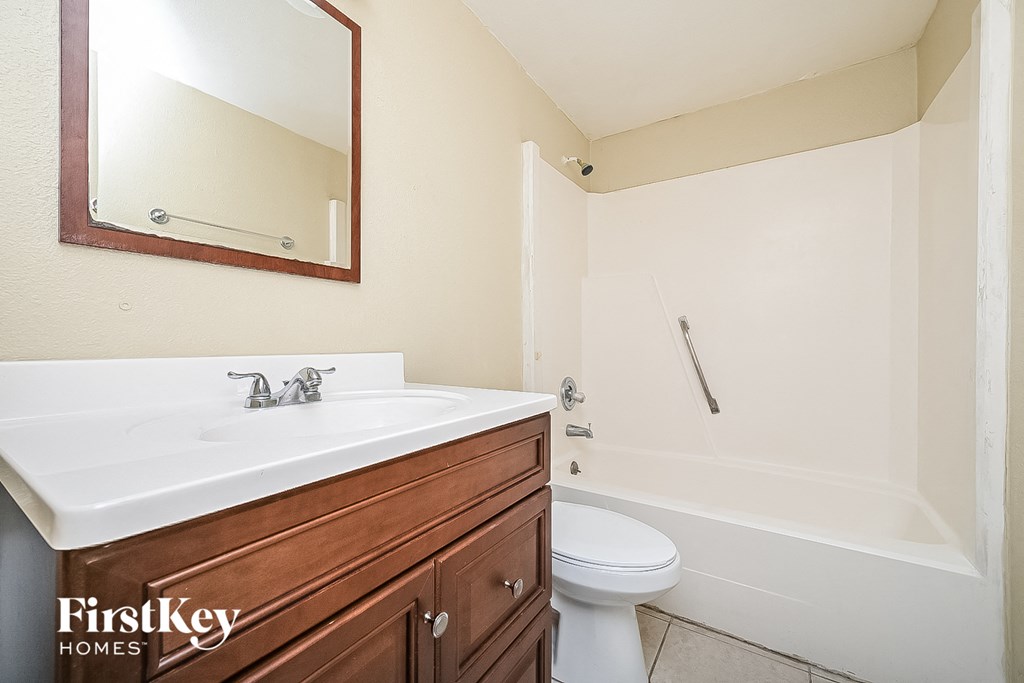 a bathroom with a sink toilet and a shower