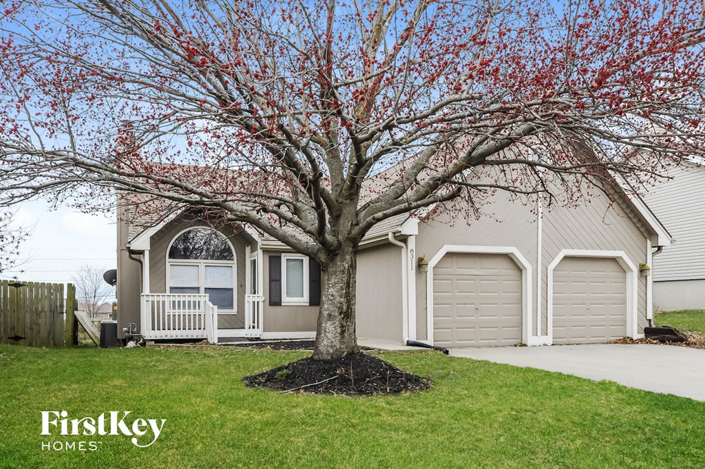 a house with a tree in front of it