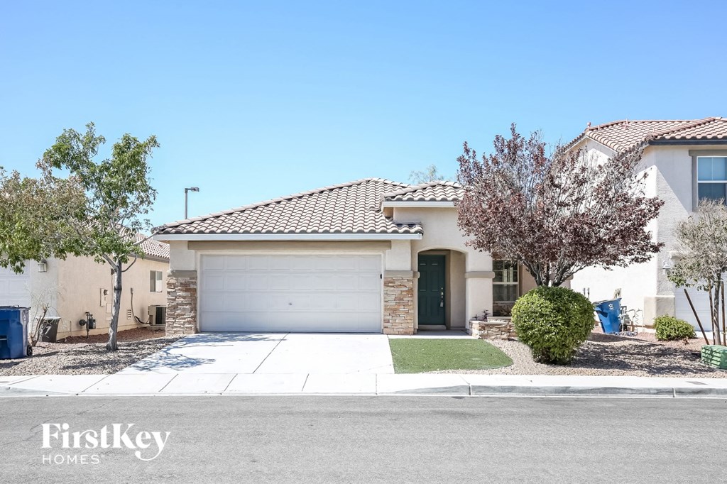 A house with a garage is for sale by FirstKey Homes.